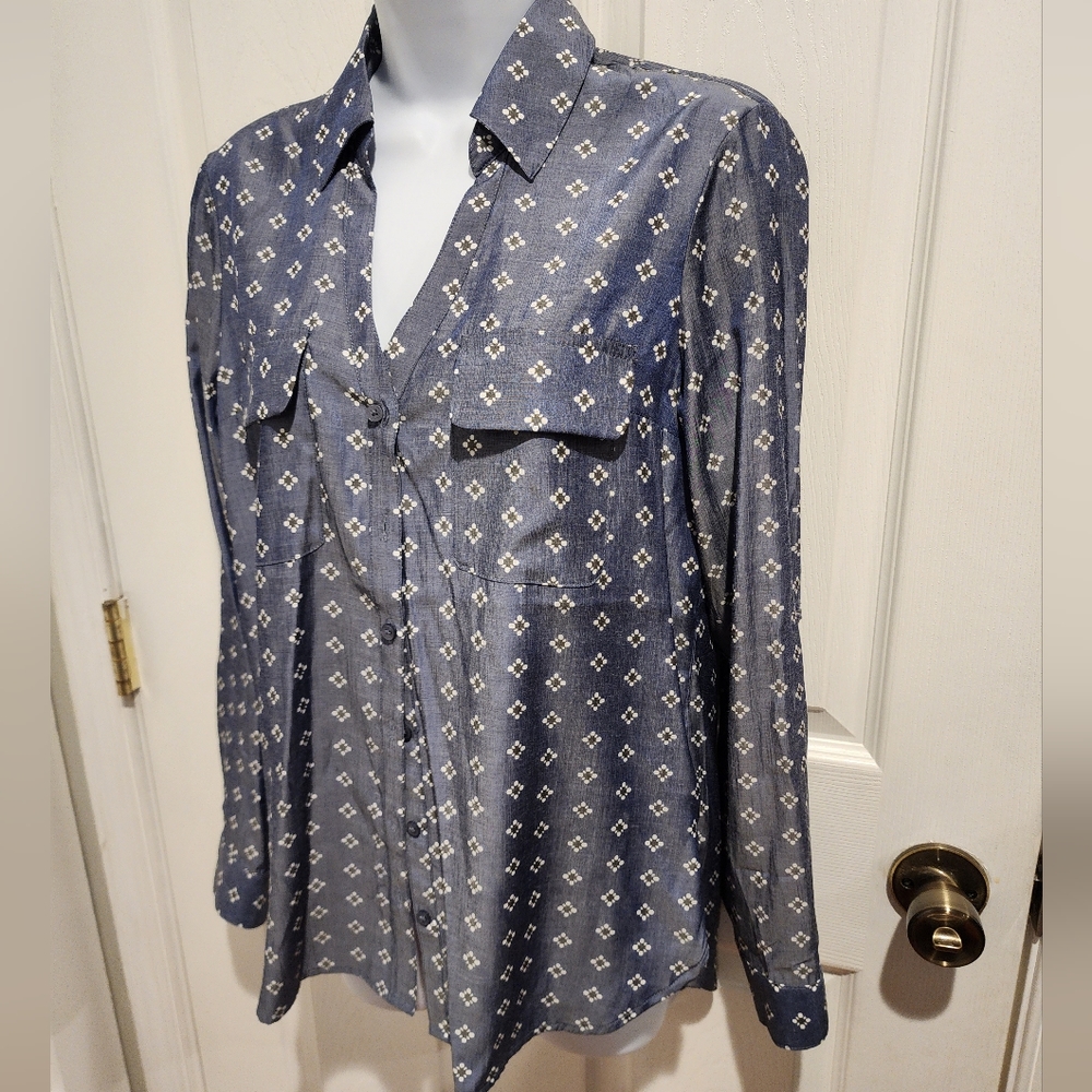EXPRESS bottom down.  60% polyester 40% viscose. Feels silky and very soft.